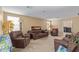 Spacious living room with sofas, lamps, and warm neutral color palette at 3209 W Apollo Rd, Phoenix, AZ 85041