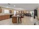 Open floor plan combining the kitchen, dining area, and living room, creating a spacious and inviting atmosphere at 3209 W Apollo Rd, Phoenix, AZ 85041