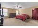 Spacious main bedroom with large dresser, ceiling fan, and ample natural light through multiple windows at 3209 W Apollo Rd, Phoenix, AZ 85041