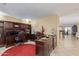 Spacious home office boasts custom built-ins, ample desk space, and neutral tile flooring at 3209 W Apollo Rd, Phoenix, AZ 85041