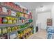 Organized pantry with shelves stocked full of food at 3209 W Apollo Rd, Phoenix, AZ 85041