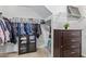 Walk-in closet boasts plentiful storage, hanging racks, and dresser at 3209 W Apollo Rd, Phoenix, AZ 85041