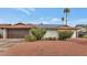 House exterior with solar panels and a well-maintained front yard at 3536 W Acapulco Ln, Phoenix, AZ 85053