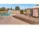 Pool area with patio furniture and basketball hoop at 3536 W Acapulco Ln, Phoenix, AZ 85053