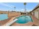 Inviting swimming pool with diving board, surrounded by a patio and a fenced backyard at 3536 W Acapulco Ln, Phoenix, AZ 85053