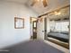 Bedroom with mirrored closet and view into bathroom at 356 S Felspar Dr, Apache Junction, AZ 85119