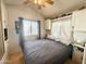 Bright bedroom with a queen bed and ceiling fan at 356 S Felspar Dr, Apache Junction, AZ 85119