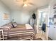 Bright bedroom with double bed, en-suite bathroom, and small work area at 356 S Felspar Dr, Apache Junction, AZ 85119