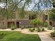 Charming two-story townhome featuring well-maintained landscaping and inviting curb appeal at 3935 E Rough Rider Rd # 1191, Phoenix, AZ 85050