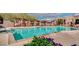 Relaxing community pool with lounge chairs and landscaping at 3935 E Rough Rider Rd # 1191, Phoenix, AZ 85050