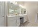 Elegant bathroom with double vanity, quartz countertop and modern fixtures at 4220 E Thistle Landing Dr, Phoenix, AZ 85044