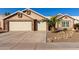 Beautiful two-story home with a landscaped front yard and two-car garage at 4220 E Thistle Landing Dr, Phoenix, AZ 85044