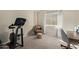 Home office or exercise room with a stationary bike and desk at 4220 E Thistle Landing Dr, Phoenix, AZ 85044