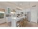 Modern kitchen with white cabinets, center island, and stainless steel appliances at 4220 E Thistle Landing Dr, Phoenix, AZ 85044