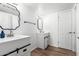 Clean bathroom with white vanity and black accents at 4334 N 19Th Dr, Phoenix, AZ 85015