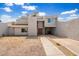 Two-story home with a brown door and gravel driveway at 4334 N 19Th Dr, Phoenix, AZ 85015