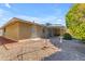 Backyard view of the home with gravel and trees at 4725 E Capri Ave, Mesa, AZ 85206