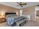 Comfortable bedroom with a king-size bed and ceiling fan at 4725 E Capri Ave, Mesa, AZ 85206