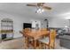 Spacious dining area with a large wooden table and access to the living room at 4725 E Capri Ave, Mesa, AZ 85206