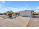 Single story home with attached garage and desert landscaping at 4725 E Capri Ave, Mesa, AZ 85206