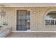 Front entrance with a security door and tiled flooring at 4725 E Capri Ave, Mesa, AZ 85206