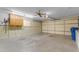 Two-car garage with overhead storage and work area at 4725 E Capri Ave, Mesa, AZ 85206