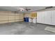 Spacious garage with ample storage and work bench at 4725 E Capri Ave, Mesa, AZ 85206