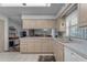 Bright kitchen features ample cabinetry and a view into the adjacent living area at 4725 E Capri Ave, Mesa, AZ 85206