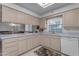 Kitchen features light wood cabinets and a breakfast bar at 4725 E Capri Ave, Mesa, AZ 85206