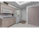 Kitchen with light wood cabinets, tile floor, and a view into dining area at 4725 E Capri Ave, Mesa, AZ 85206