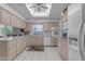 Kitchen with light wood cabinets, tile floors, and a skylight at 4725 E Capri Ave, Mesa, AZ 85206