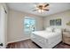 Comfortable bedroom with a ceiling fan, natural light from the window and a neutral color palette at 4903 W Palm Ln, Phoenix, AZ 85035