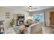 Comfortable living room with a stone fireplace, ceiling fan, and a large window with natural light at 4903 W Palm Ln, Phoenix, AZ 85035