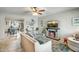 Open-concept living room with a fireplace, dining area, and ample space for entertaining guests at 4903 W Palm Ln, Phoenix, AZ 85035