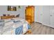 Main bedroom with wood armoire and flooring at 49201 N 24Th Ave, New River, AZ 85087