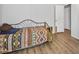 Bedroom with daybed and wood flooring at 49201 N 24Th Ave, New River, AZ 85087