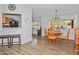 Bright dining room with wooden table and chairs, and views to the outdoors at 49201 N 24Th Ave, New River, AZ 85087