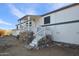 Home exterior showcasing a wooden porch and stonework at 49201 N 24Th Ave, New River, AZ 85087