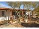 White house with covered porch, wooden posts, and landscaped yard at 49201 N 24Th Ave, New River, AZ 85087