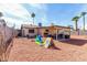 Large backyard featuring desert landscaping, covered patio, and play area at 5114 W Corrine Dr, Glendale, AZ 85304