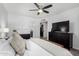 Bright main bedroom features an ensuite bathroom, closet, ceiling fan, and sleek furnishings at 5114 W Corrine Dr, Glendale, AZ 85304