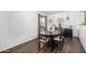 Elegant dining room featuring a dark wood table, stylish chairs, and modern decor at 5114 W Corrine Dr, Glendale, AZ 85304