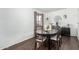 Charming dining room with a dark wood table, stylish chairs, and decorative hanging plants at 5114 W Corrine Dr, Glendale, AZ 85304