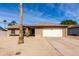 Charming single-story home with desert landscaping, a two-car garage and a well-maintained brick facade at 5114 W Corrine Dr, Glendale, AZ 85304