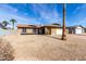 Inviting home with desert landscaping, a two-car garage, and window boxes adding charm at 5114 W Corrine Dr, Glendale, AZ 85304