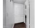 Hallway featuring a large, white built-in linen closet with paneled doors at 5114 W Corrine Dr, Glendale, AZ 85304