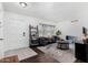 Bright living room with modern furnishings, neutral tones, and a stylish area rug at 5114 W Corrine Dr, Glendale, AZ 85304