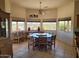 Dining area featuring a large table with scenic views and natural light at 55823 N 329Th Dr, Wickenburg, AZ 85390