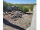 Landscaped yard with rock features and desert plants at 55823 N 329Th Dr, Wickenburg, AZ 85390