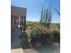 Covered patio with wooden posts and mountain views at 55823 N 329Th Dr, Wickenburg, AZ 85390